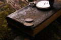 Pocket watch with old antique bible book and retro coins Royalty Free Stock Photo