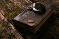 Pocket watch with old antique bible book and retro coins Royalty Free Stock Photo