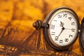 Pocket watch on old map background, Royalty Free Stock Photo