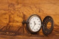 Pocket watch on old map background, Royalty Free Stock Photo