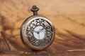 Pocket watch on old map background, vintage Royalty Free Stock Photo