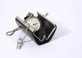 Pocket watch into purse Royalty Free Stock Photo