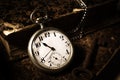 Pocket watch and a stack of books.