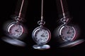 Pocket watch swinging on a chain to hypnotise Royalty Free Stock Photo
