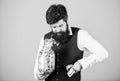 Pocketing company savings. Bearded man taking money savings out of glass jar. Businessman stealing business savings Royalty Free Stock Photo