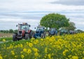 Convoy of Tractors on country road