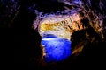 Poco Encantado, blue lagoon with sunrays inside a cavern in the Chapada Diamantina, Andarai, Bahia, Brazil