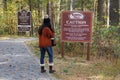 Poconos County, Pennsylvania, U.S - October 21, 2023 - A girl reading the informational sign into Bushkill Falls