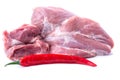 Pod of red chilli and a piece of pork tenderloin on a white isolated background Royalty Free Stock Photo