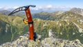 The Petzl Ride ice axe comes in handy also during autumn hikes in the high mountains Royalty Free Stock Photo