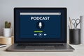 Podcast concept on laptop screen on modern desk