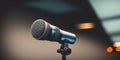 Podcast microphone on a tripod, a black metal dynamic microphone in recording studio background, for recording podcast