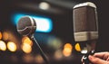 Podcast microphone on a tripod, a black metal dynamic microphone in recording studio background, for recording podcast