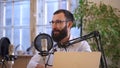 Podcast recording at home narrator speaks into mic in studio Spbas