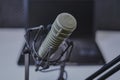 Podcast microphone with laptop computer in background Royalty Free Stock Photo