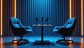Podcast studio setup features chairs microphones table. Blue neon lights create modern ambiance. Audio recording broadcasting Royalty Free Stock Photo