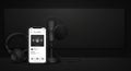 Podcast Studio Setup with Microphone, Headphones, and Mobile App on Dark Background Royalty Free Stock Photo