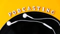 Podcasting lettering and vinyl record album, headphones in minimalistic style on yellow background. Millenial. Blogger, podcaster