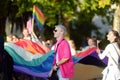 Podgorica, Montenegro - October 8, 2022: View group of people holding large rainbow flag during the Ten LGBT Pride Parade held in