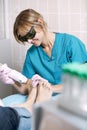 Podiatrist doing a foot laser treatment