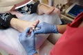 Podiatrist treating toenail fungus. Royalty Free Stock Photo