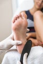 Beautician foot treatment.Treatment of feet and nails. Royalty Free Stock Photo