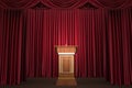 Podium and microphone in the center of the theatrical stage Royalty Free Stock Photo