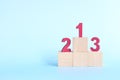 Podium, ranking and hierarchy concept. Wooden blocks with numbers 123 in blue background. Royalty Free Stock Photo