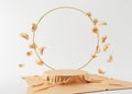 Podium with silk, golden ring and flying golden petals on the cream background. 3D rendering. Elegant podium for product