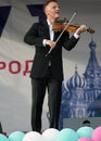 Alexey Alexeyev play on violin during event `Day of the Moscow city` in Znamya Oktyabrya