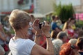 Unidentified spectator filming a concert