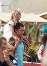 Spectator with girl on shoulders watch a show Day of the Moscow city