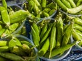 Pods of young peas in plastic glasses on a tray Royalty Free Stock Photo