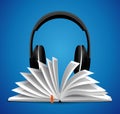 Audiobook concept - opened book with headphones