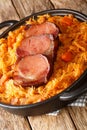 Podvarak Serbian Baked Sauerkraut with smoked meat closeup in the pan. Vertical Royalty Free Stock Photo