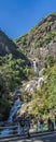 Poeple at the Ravana Waterfalls Ella, near Ella Town, Sri Lanka, vertical