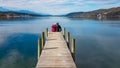 Poertschach - Couple sitting at the pier at Woertersee in Carinthia, Austria Royalty Free Stock Photo