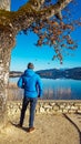 Poertschach - Man standing at the shore of the Woerthersee in Carinthia Royalty Free Stock Photo