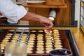 Poffertjes, little Dutch Pancakes, at baking store market.