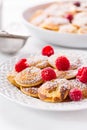 Poffertjes - small Dutch pancakes with fresh raspberries