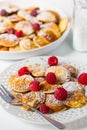Poffertjes - small Dutch pancakes with fresh raspberries