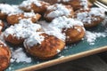 `Poffertjes`, a traditional Dutch batter treat dish resembling small, fluffy pancakes