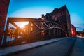 Poggenmuehlen Bridge at dawn. Hamburg, Germany. illuminated buildings and last sunrays. Warehouse District Speicherstadt