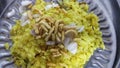 Poha with Sev and onion is a Famous breakfast in Indian states of Gujarat, Madhya Pradesh, Maharashtra and Gujarat