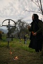 Poienile Izei, Maramures, Romania, October 19, 2018: Person praying in the cemetery at holy day