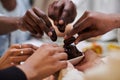 In a poignant close-up, the diverse hands of a Muslim family delicately grasp fresh dates, symbolizing the breaking of