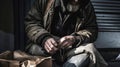 Human Struggle: Portrait of a Homeless Man, Hands Dirty, Wearing Disheveled Coat, Seeking Shelter
