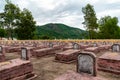 Loww Down Perspective of Communist War Graves from Vietnam War, with hills in the background