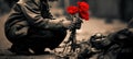 a sad boy with flowers. on his knees. retro vintage noir. farewell, saying goodbye. peace concept. no more war. Royalty Free Stock Photo