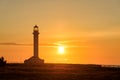 Point Arena Lighthouse at orange sunset, California Royalty Free Stock Photo